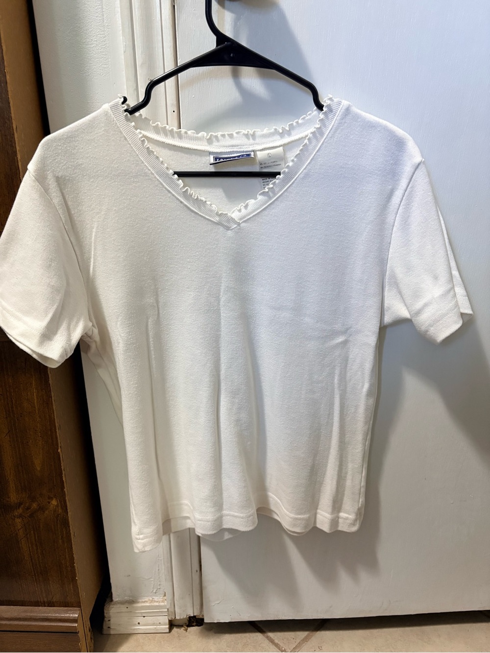 Women's White V-Neck Short Sleeve Tee with Ruffle Trim